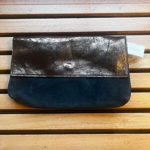 ANTHROPOLOGIE NWT - Clutch. Charcoal suede w/ bronze leather flap. Snap closure.